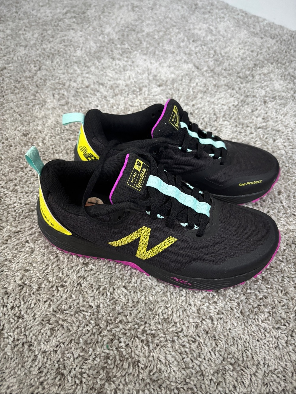 New Balance Black Sneakers with Yellow Logo & Aqua Laces